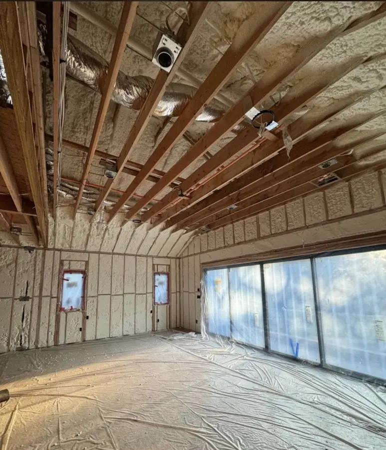Interior walls and ceiling insulated with spray foam during new construction in North Druid Hills